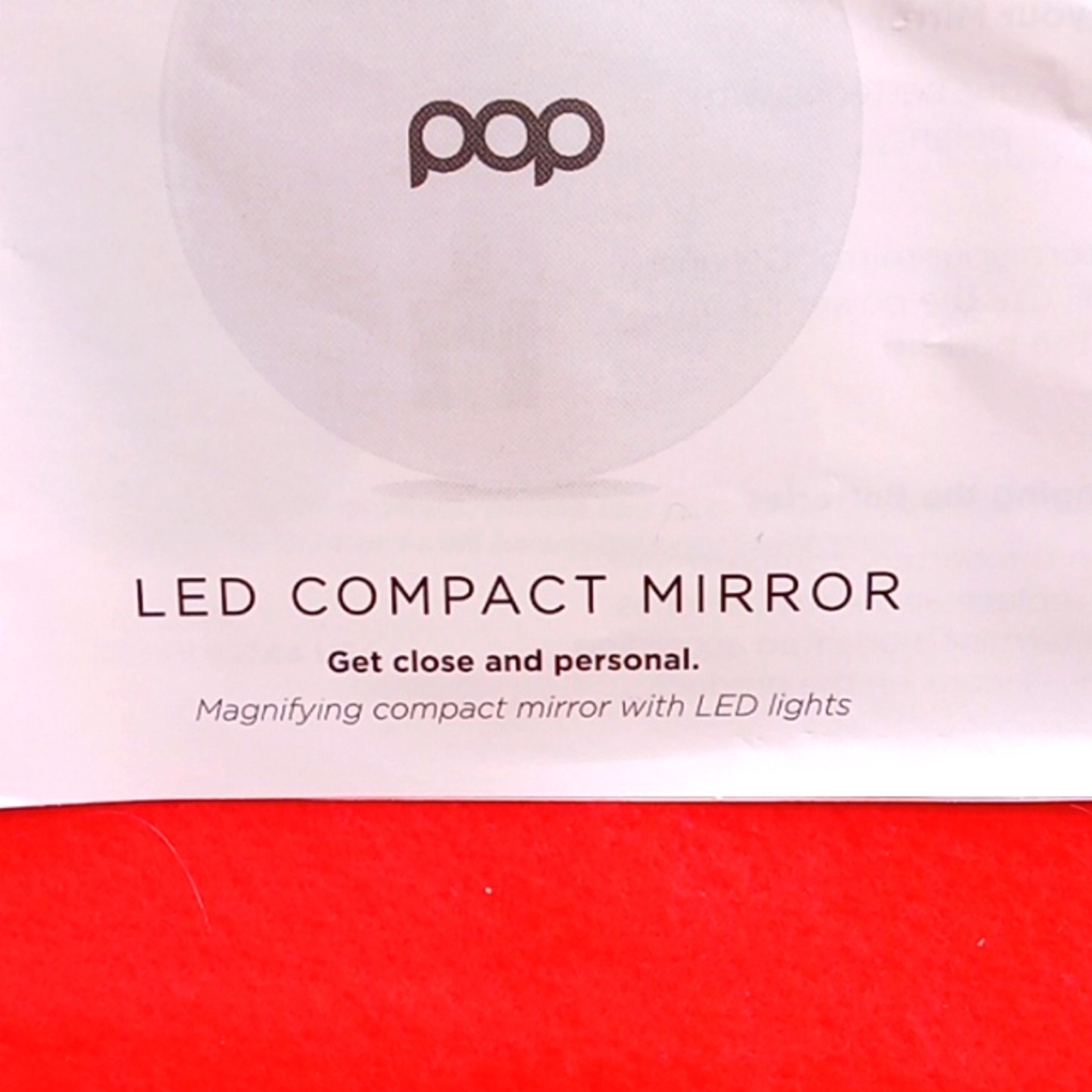 NEW.  POP SONIC MAGNIFYING  COMPACT MIRROR WITH LED LIGHTS